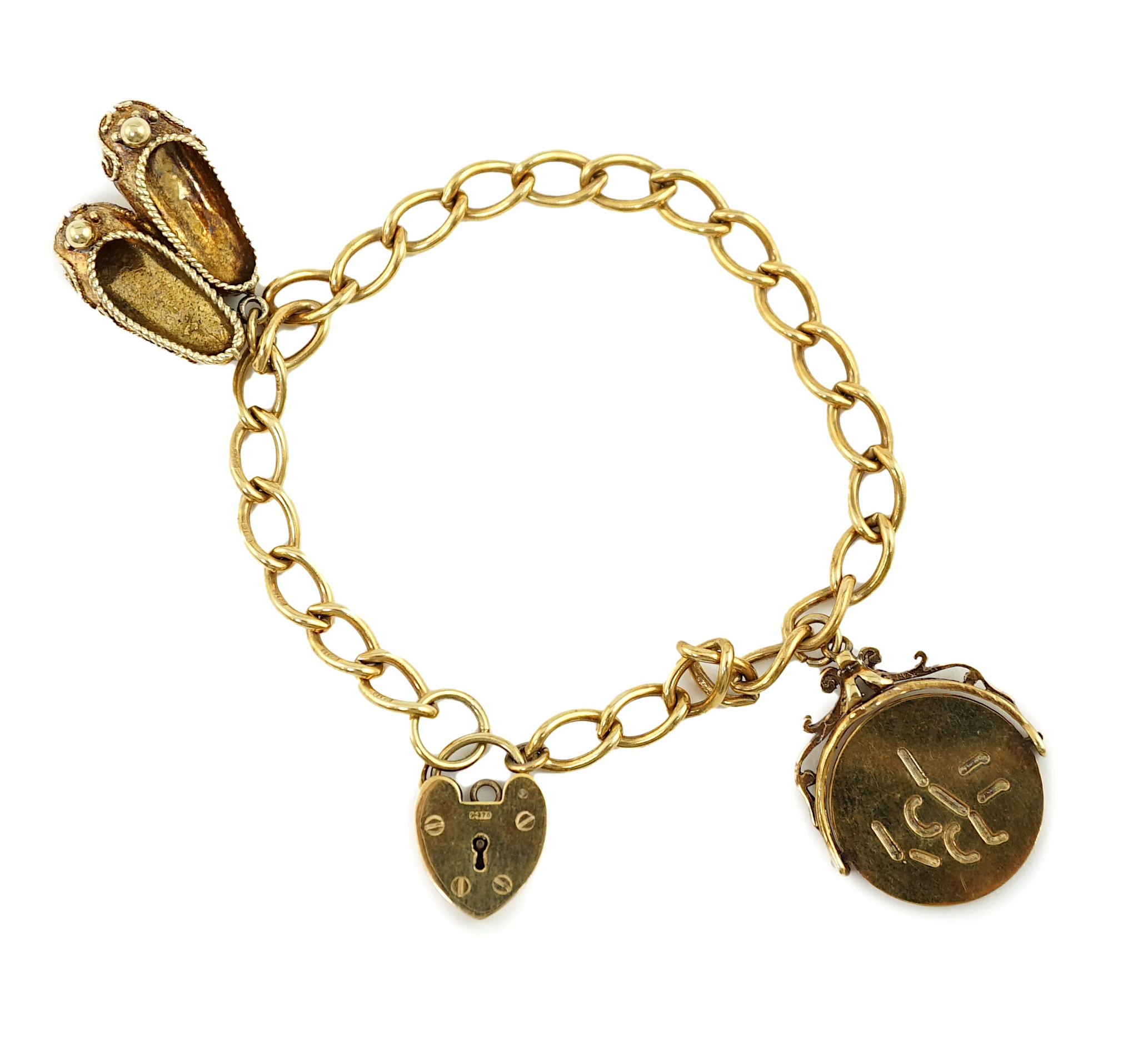 A 1960's 9ct gold oval link charm bracelet